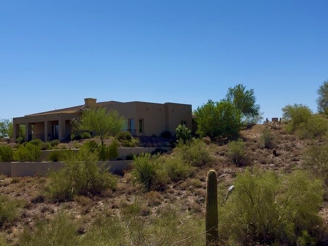 Cleared defensible space around a homeowner's property in Arizona